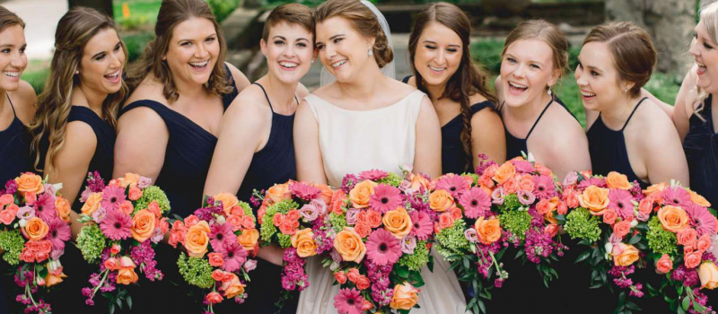 Bride and her bridesmaids with bouquets from Belle Fiori