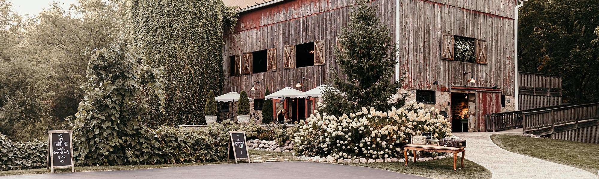 Exterior of Farm at The Dover barn with signage from Esty and Amazon